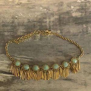 Gold necklace with green beads